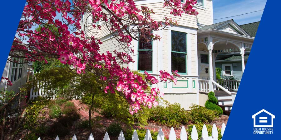 A house behind flowers.