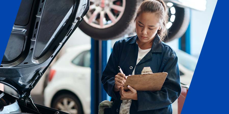 A women working on a car.
