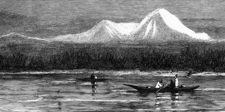 People in canoes on the Puget Sound, with Mount Rainier in the background.