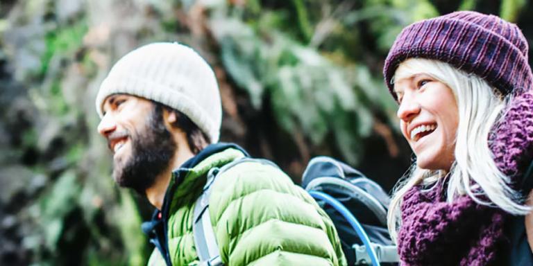 Couple hiking in the Pacific Northwest wilderness.