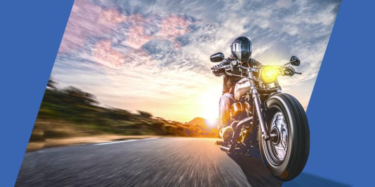 Motorcycle rider riding at sunset.