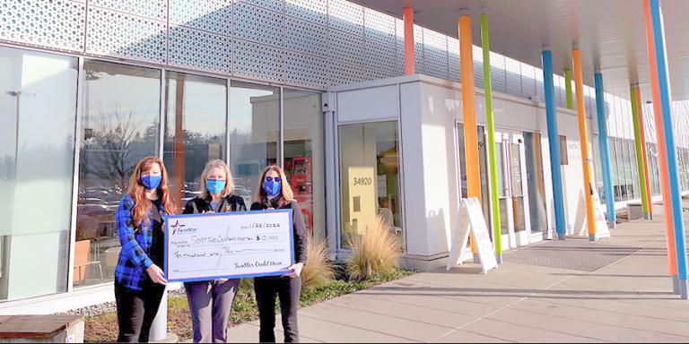 TwinStar team presenting a check to Seattle Children's.
