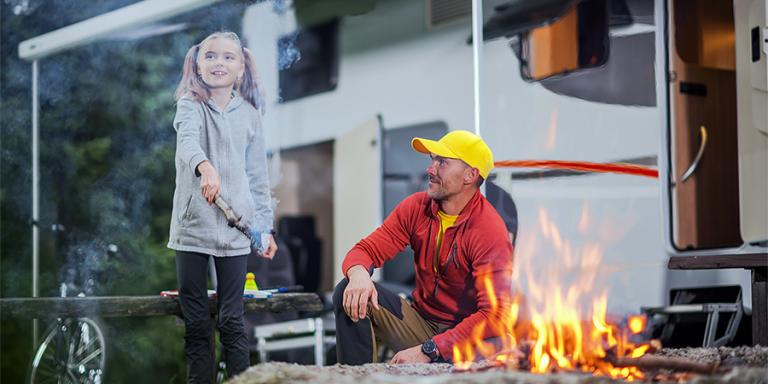 Dad and daughter enjoying a camping trip