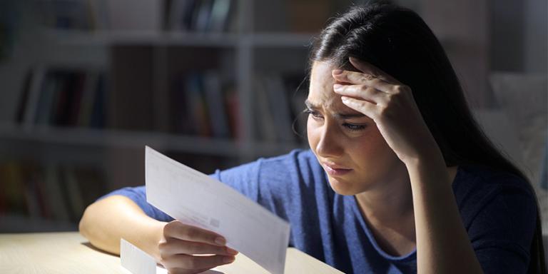 Women looking at a piece of mail