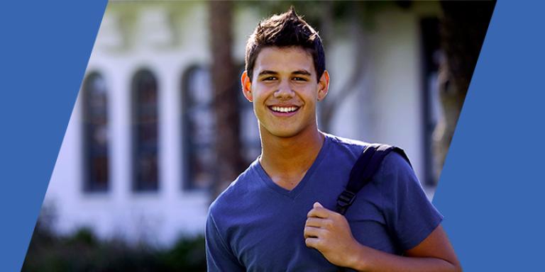 College student in front of building with backpack