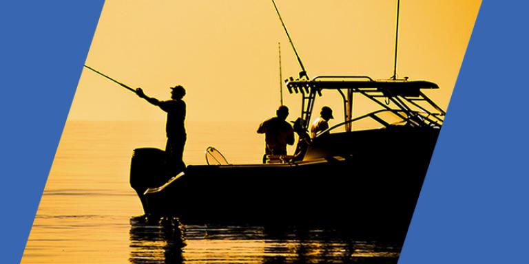 Fishing boat with sunset in the background