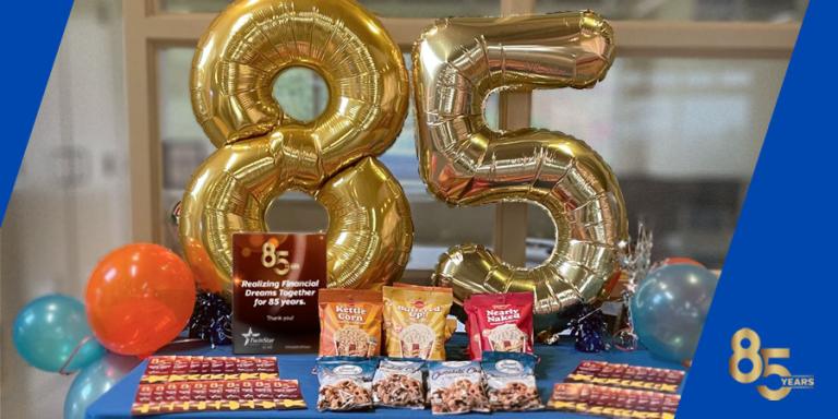 TwinStar 85th anniversary balloons with giveaways and treats.