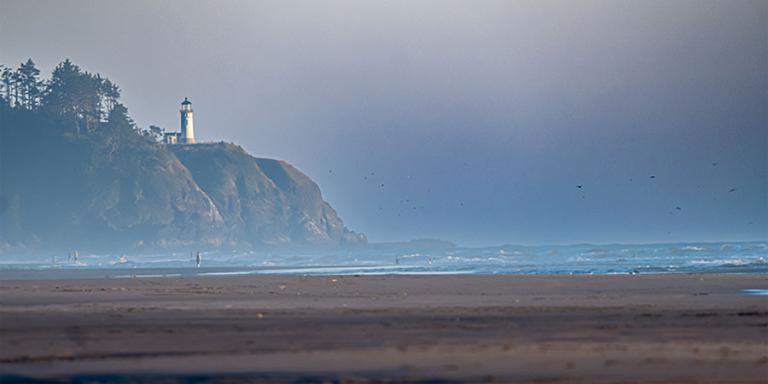 Lighthouse on a cliff at the coast