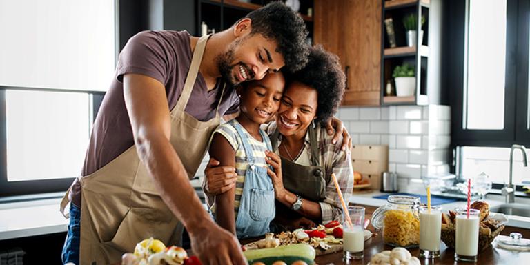 Family preparing a meal in their kitchen