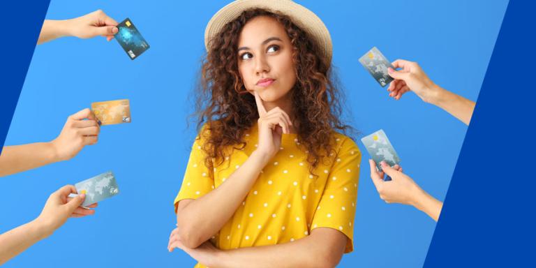 Hands waving credit cards around woman as she decides on which card to choose.