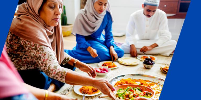 Muslim family having dinner on the floor.
