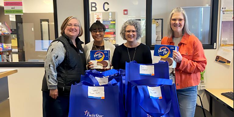 Pictured from left to right: Amanda Stevens, Jennie Fulton, Amy Richardson, and Kristen Tulloch with boxes of Moonpies.