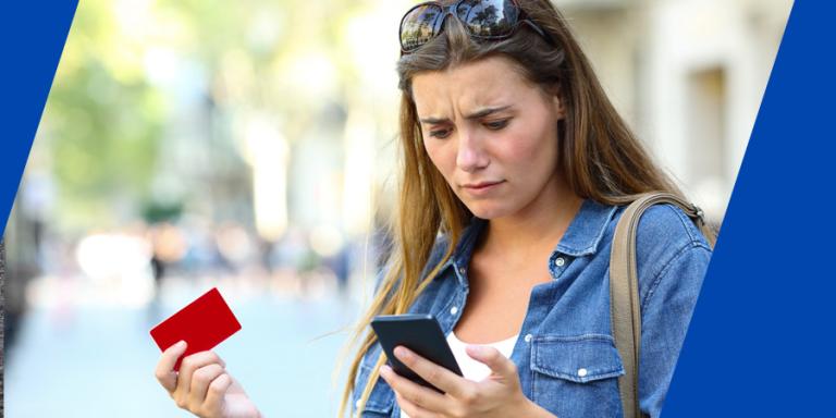 Victim of a phishing scam checking her phone.