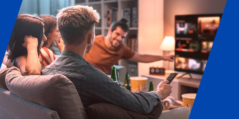 Friends watching movies together at home using a subscription service.
