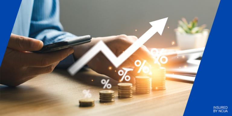 Image with a row of coins stacking higher and a growth arrow superimposed over it.