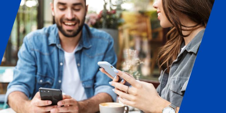 Man paying for his half of brunch to his friend via a payment app.