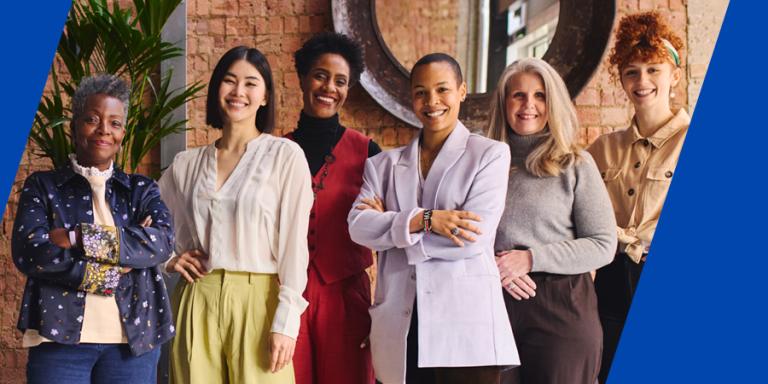 Group of diverse businesswomen posing for a photo.