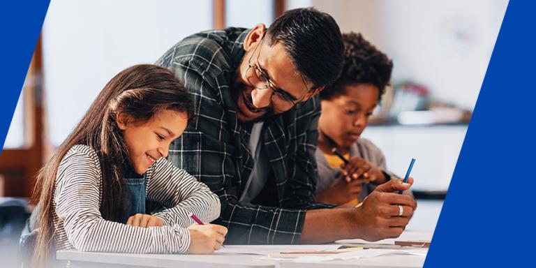 Teacher leading an art lesson with elementary school students.