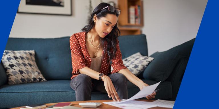 Woman looking over her credit report.