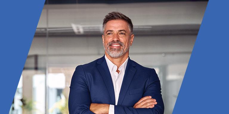 Man in a suit with his arms folded