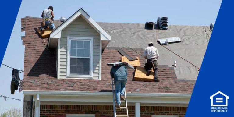 Workers on top of a roof