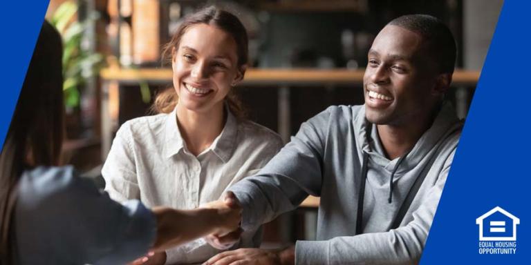 Two people meeting with a mortgage lender