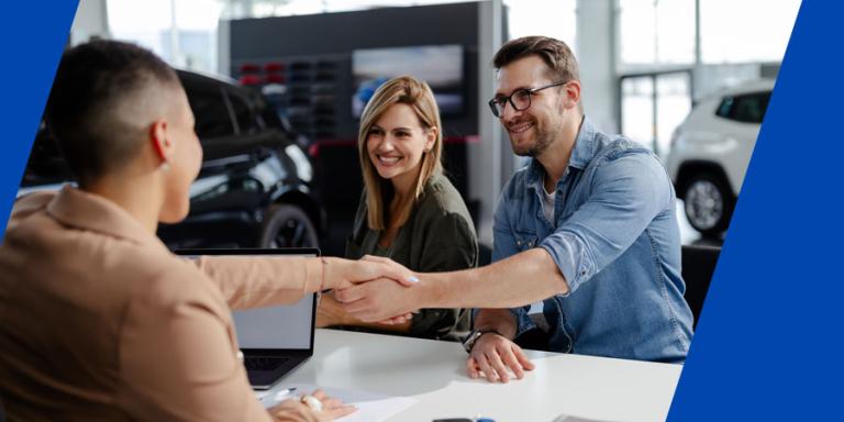A couple closing on a car loan. 
