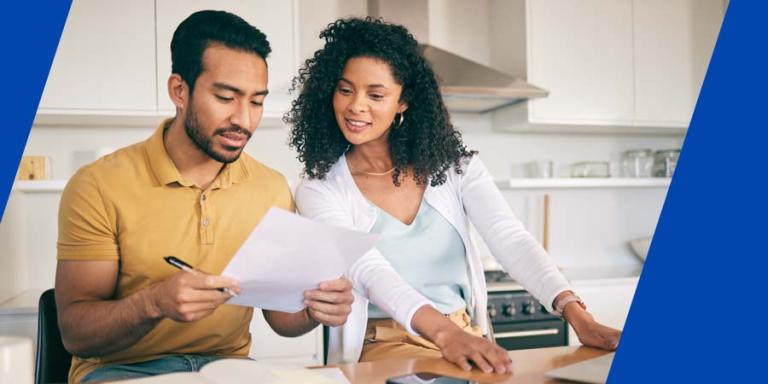 A couple going over an insurance policy