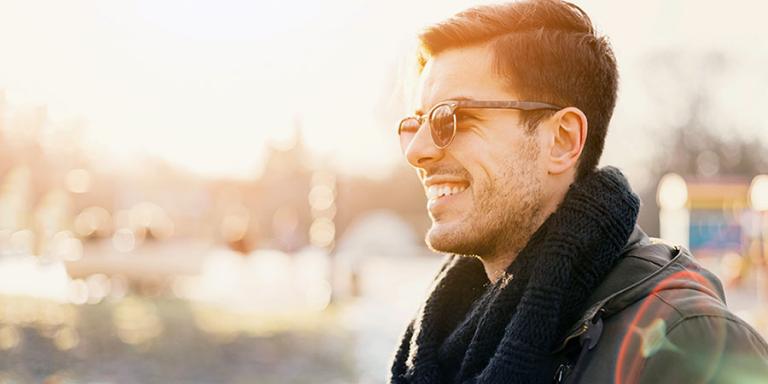 Smiling man outside wearing sunglasses 